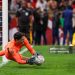 Morocco's goalkeeper #01 Yassine Bounou stops a penaly kick from Nigeria's forward #11 Samuel Chukwueze during the Africa Cup of Nations (CAN) semi-final football match between Nigeria and Morocco (Photo by FRANCK FIFE / AFP via Getty Images)