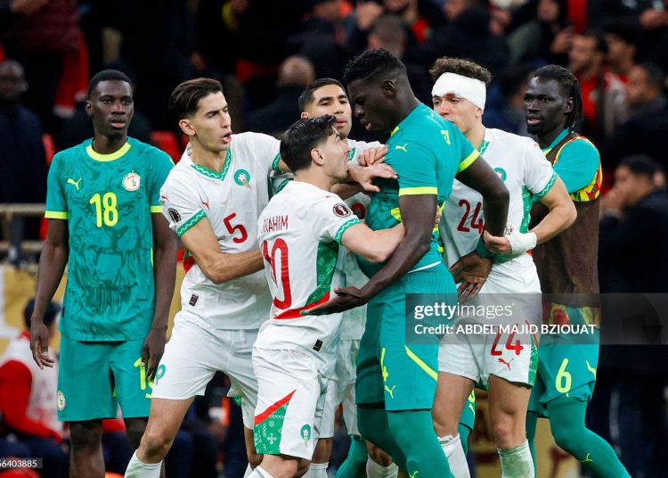 Senegal and Morocco players clash during the Africa Cup of Nations (CAN) final football match between Senegal and Morocco (Photo by Abdel Majid BZIOUAT / AFP via Getty Images)