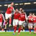 Ben White of Arsenal celebrates scoring his team's first goal with teammates during the Carabao Cup Semi Final First Leg match between Chelsea and Arsenal (Photo by Stuart MacFarlane/Arsenal FC via Getty Images)