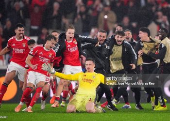 Anatoliy Trubin of Benfica celebrates scoring his team's fourth goal with a header with teammates during the UEFA Champions League 2025/26 League Phase MD8 match between SL Benfica and Real Madrid (Photo by Jose Manuel Alvarez Rey/Getty Images)