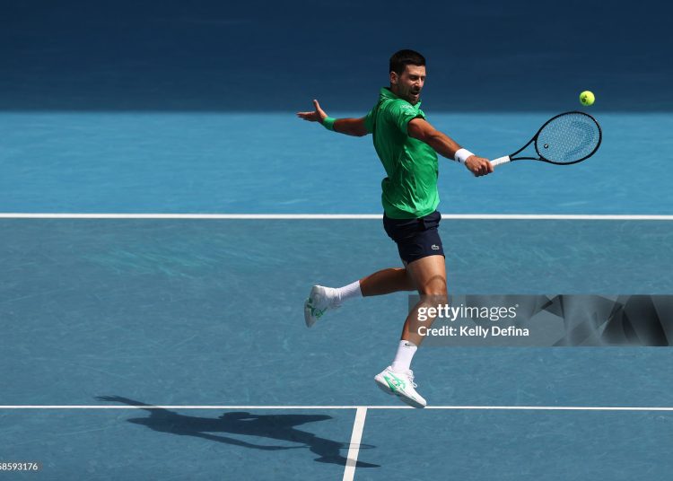 Novak Djokovic of Serbia plays a backhand in the Men's Singles Quarterfinal against Lorenzo Musetti of Italy during day 11 of the 2026 Australian Open (Photo by Kelly Defina/Getty Images)