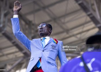 Congolese supporter Michel Nkuka Mboladinga raises his arm during the Africa Cup of Nations 2025 round of 16 match between Algeria and the Democratic Republic of the Congo at Moulay Hassan Stadium in Rabat, Morocco, on January 6, 2025, reenacting the iconic pose of former Congolese Prime Minister and independence leader Patrice Lumumba to draw attention to his countryâs history during the match. Lumumba was executed by Belgian soldiers on January 17, 1961, and the gesture mirrors his memorial statue in Kinshasa (Photo by Abu Adem Muhammed/Anadolu via Getty Images)