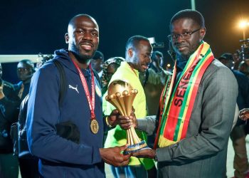 Khalidou Koulibaly (left) presents AFCON trophy to Senegal President Bassirou Faye Photo Courtesy: RTS Senegal