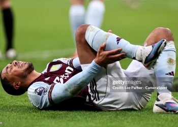 Aston Villa's Youri Tielemans grimaces as he holds his leg during the Premier League match between Newcastle United and Aston Villa (Photo by Lee Parker - CameraSport via Getty Images)