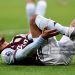 Aston Villa's Youri Tielemans grimaces as he holds his leg during the Premier League match between Newcastle United and Aston Villa (Photo by Lee Parker - CameraSport via Getty Images)