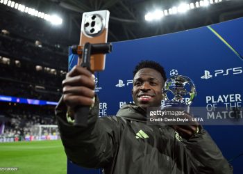 Vinicius Junior of Real Madrid poses for a photo with the PlayStation Player Of The Match award after the UEFA Champions League 2025/26 League Phase MD7 match between Real Madrid C.F. and AS Monaco (Photo by Denis Doyle - UEFA/UEFA via Getty Images)