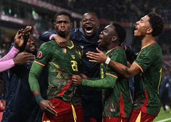 Cameroon's forward #26 Christian Kofane celebrates scoring his team's second goal . (Photo by Paul ELLIS / AFP via Getty Images)
