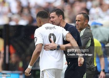 Kylian Mbappe #9 of Real Madrid C.F. speaks with Xabi Alonso, Head Coach of Real Madrid C.F.,  as he enters the pitch during the FIFA Club World Cup 2025 round of 16 match between Real Madrid CF and Juventus FC (Photo by Megan Briggs/Getty Images)