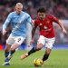 Lisandro Martinez  is challenged by Erling Haaland during the Premier League match between Manchester United and Manchester City at Old Trafford on January 17, 2026 in Manchester, England. (Photo by Carl Recine/Getty Images)