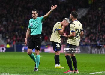 Referee Jose Maria Sanchez Martinez gestures for a direct free kick after a handball from Eric Garcia of FC Barcelona during the Copa Del Rey Semi-Final First Leg match between Atletico de Madrid and FC Barcelona (Photo by Aitor Alcalde/Getty Images)