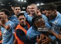 Manchester City's Norwegian striker #09 Erling Haaland (C) celebrates with teammates after scoring his team's second goal during the English Premier League football match between Liverpool and Manchester City (Photo by Paul ELLIS / AFP via Getty Images)