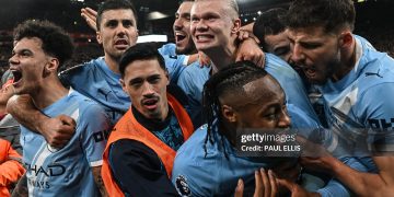 Manchester City's Norwegian striker #09 Erling Haaland (C) celebrates with teammates after scoring his team's second goal during the English Premier League football match between Liverpool and Manchester City (Photo by Paul ELLIS / AFP via Getty Images)