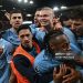 Manchester City's Norwegian striker #09 Erling Haaland (C) celebrates with teammates after scoring his team's second goal during the English Premier League football match between Liverpool and Manchester City (Photo by Paul ELLIS / AFP via Getty Images)