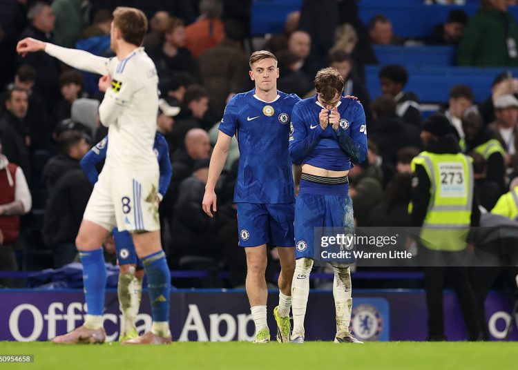 Cole Palmer of Chelsea reacts after missing a chance at an open goal as his teammate Liam Delap interacts with him during the Premier League match between Chelsea and Leeds (Photo by Warren Little/Getty Images)