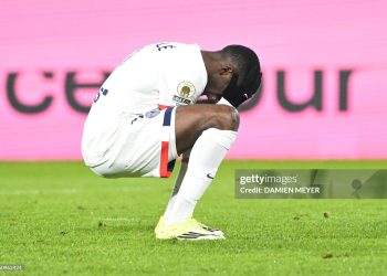 Paris Saint-Germain's French forward #10 Ousmane Dembele reacts after missing a shot during the French L1 football match between Stade Rennais FC and Paris Saint-Germain (PSG) (Photo by Damien MEYER / AFP via Getty Images)