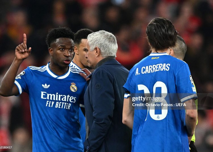 Vinicius Junior of Real Madrid speaks to Jose Mourinho, Head Coach of Benfica, after a clash with Gianluca Prestianni during the UEFA Champions League 2025/26 League Knockout Play-off First Leg match between SL Benfica and Real Madrid (Photo by Octavio Passos - UEFA/UEFA via Getty Images)