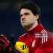 Senne Lammens of Manchester United warms up prior to the Premier League match between Everton and Manchester United (Photo by Ash Donelon/Manchester United via Getty Images)