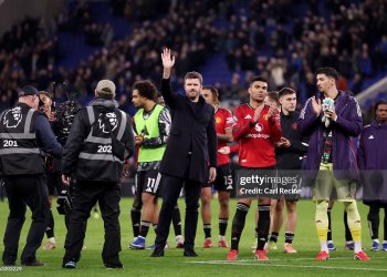 Michael Carrick, Manager of Manchester United, acknowledges the fans following the teams victory in the Premier League match between Everton and Manchester United (Photo by Carl Recine/Getty Images)