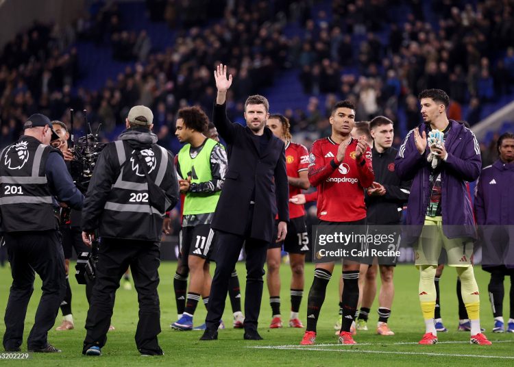 Michael Carrick, Manager of Manchester United, acknowledges the fans following the teams victory in the Premier League match between Everton and Manchester United (Photo by Carl Recine/Getty Images)