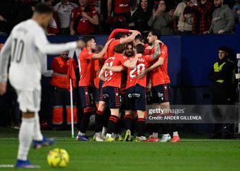 Osasuna's players celebrate the opening goal, scored by Croatian forward #17 Ante Budimir (2L) celebrates after scoring the opening goal from the penalty spot, during the Spanish league football match between CA Osasuna and Real Madrid  (Photo by ANDER GILLENEA / AFP via Getty Images)