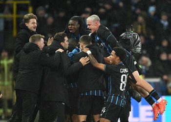 Club Brugge's celebrate after Club Brugge's Greek forward #08 Christos Tzolis scored his team's third goal during the UEFA Champions League knockout round play-off first leg football match between Club Brugge and Atletico Madrid at the Jan Breydel Stadium in Brugge on February 18, 2026. (Photo by NICOLAS TUCAT / AFP via Getty Images)