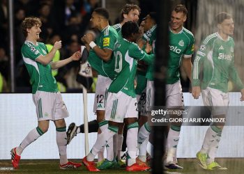 Newcastle United's English midfielder #10 Anthony Gordon celebrates with teammates after scoring the team's first goal during the UEFA Champions League knockout phase play-off first leg football match between Qarabag and Newcastle at the Tofiq Bahramov Republican Stadium in Baku on February 18, 2026. (Photo by Giorgi ARJEVANIDZE / AFP via Getty Images)