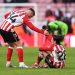 Granit Xhaka of Sunderland helps teammate Enzo Le Fee up as they reflect on defeat after the Premier League match between Sunderland and Fulham at Stadium of Light on February 22, 2026 in Sunderland, England. (Photo by George Wood/Getty Images)