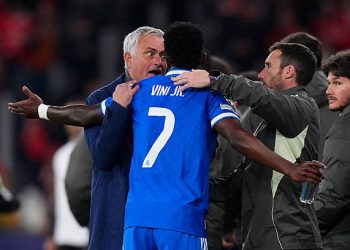 Jose Mourinho, Head Coach of Benfica, speaks to Vinicius Junior of Real Madrid during the UEFA Champions League 2025/26 League Knockout Play-off First Leg match between SL Benfica and Real Madrid C.F. at Estadio do SL Benfica on February 17, 2026 in Lisbon, Portugal. (Photo by Angel Martinez/Getty Images)