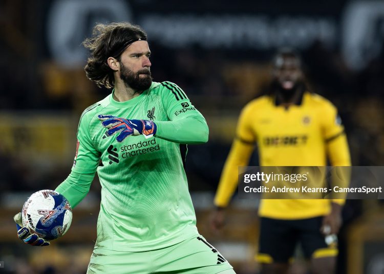 Liverpool's goalkeeper Alisson Becker throws the ball upfield during the Emirates FA Cup Fifth Round match between Wolverhampton Wanderers and Liverpool (Photo by Andrew Kearns - CameraSport via Getty Images)