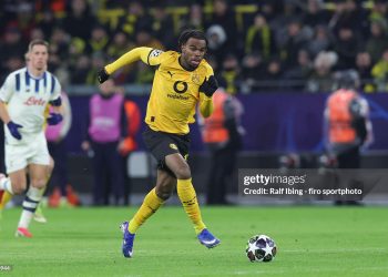 Carney Chukwuemeka of Borussia Dortmund plays the ball during the UEFA Champions League 2025/26 League Knockout Play-off First Leg match between Borussia Dortmund and Atalanta BC at BVB Stadion Dortmund (Photo by Ralf Ibing - firo sportphoto/Getty Images)