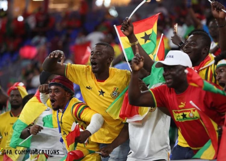 Fans of the Black Stars cheering the team up . photo credit : GFA communications