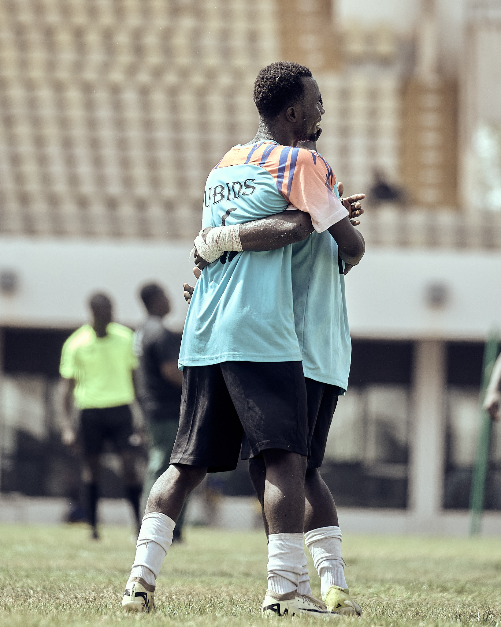 UBIDS players hugging on the pitch