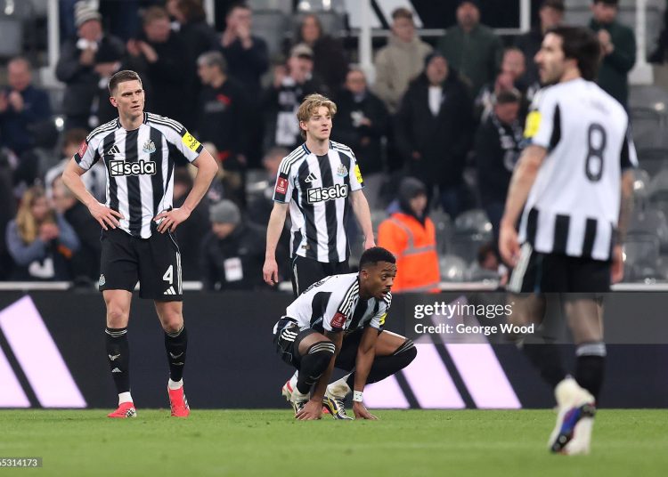 Sven Botman, Anthony Gordon and Joe Willock of Newcastle United looks dejected following the Emirates FA Cup Fifth Round match between Newcastle United and Manchester City (Photo by George Wood/Getty Images)