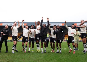 Players of Port Vale celebrate the teams victory following the Emirates FA Cup Fifth Round match between Port Vale and Sunderland on March 08, 2026 in Burslem, England. (Photo by Carl Recine/Getty Images)