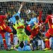 Dominic Adiyiah of Ghana heads the ball towards goal and Luis Suarez of Uruguay handles the ball off the line during the 2010 FIFA World Cup South Africa Quarter Final match between Uruguay and Ghana at the Soccer City stadium on July 2, 2010 in Johannesburg, South Africa.  (Photo by Paul Gilham - FIFA/FIFA via Getty Images)