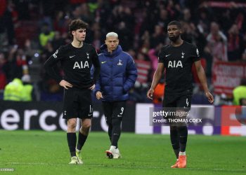 Tottenham Hotspur's English midfielder #14 Archie Gray (L), Tottenham Hotspur's Brazilian forward #09 Richarlison and Tottenham Hotspur's Austrian defender #04 Kevin Danso react at the end of the UEFA Champions League last 16 first leg football match between Club Atletico de Madrid and Tottenham (Photo by Thomas COEX / AFP via Getty Images)