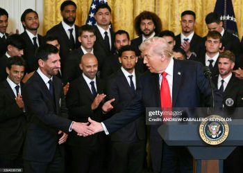 US President Donald Trump shakes hand with Argentinian star Lionel Messi during an event for Inter Miami CF, winners of the 2025 Major League Soccer Cup, in the East Room of the White House (Photo by ANDREW CABALLERO-REYNOLDS / AFP via Getty Images)