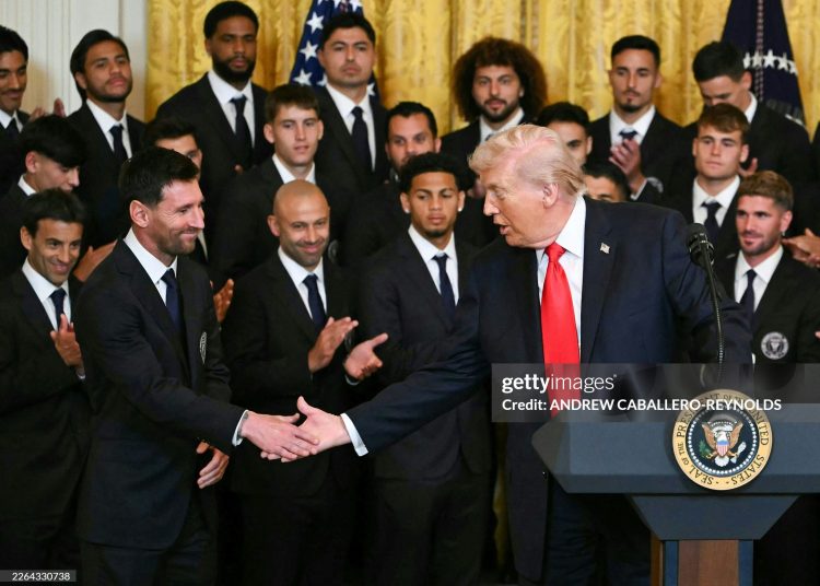 US President Donald Trump shakes hand with Argentinian star Lionel Messi during an event for Inter Miami CF, winners of the 2025 Major League Soccer Cup, in the East Room of the White House (Photo by ANDREW CABALLERO-REYNOLDS / AFP via Getty Images)