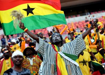 A Ghanian supporter cheers on. AFP PHOTO / STEPHANE DE SAKUTIN