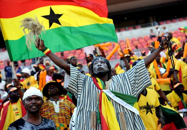 A Ghanian supporter cheers on.  AFP PHOTO / STEPHANE DE SAKUTIN