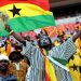 A Ghanian supporter cheers on.  AFP PHOTO / STEPHANE DE SAKUTIN