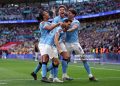 Nico Gonzalez of Manchester City celebrates scoring his team's second goal with teammates Nathan Ake, Bernardo Silva and John Stones during the Emirates FA Cup Semi Final match between Manchester City and Southampton (Photo by Justin Setterfield/Getty Images)
