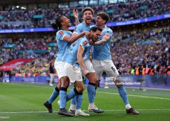 Nico Gonzalez of Manchester City celebrates scoring his team's second goal with teammates Nathan Ake, Bernardo Silva and John Stones during the Emirates FA Cup Semi Final match between Manchester City and Southampton (Photo by Justin Setterfield/Getty Images)