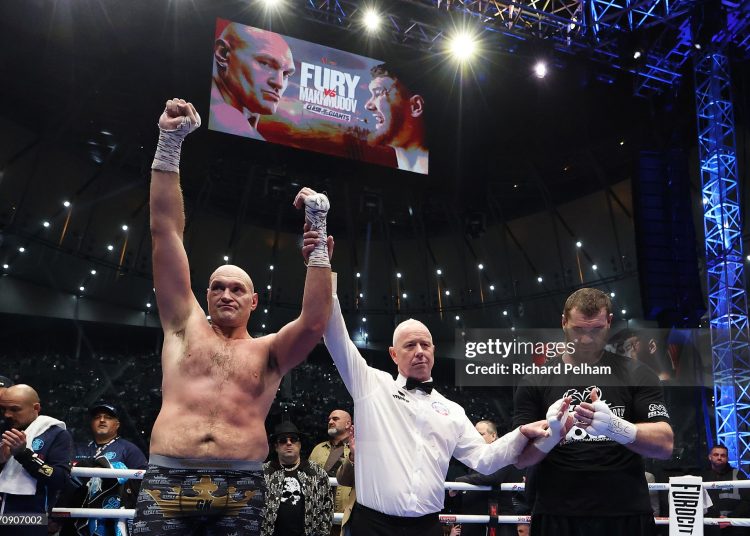 Tyson Fury has his hand raised following victory in the Heavyweight fight between Tyson Fury and Arslanbek Makhmudov (Photo by Richard Pelham/Getty Images for Netflix)