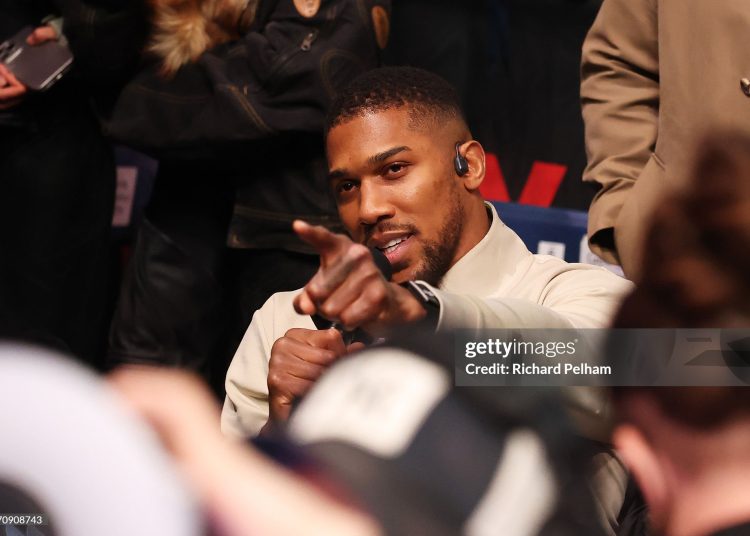 Anthony Joshua gestures towards Tyson Fury (not pictured) after the Heavyweight fight between Tyson Fury and Arslanbek Makhmudov (Photo by Richard Pelham/Getty Images for Netflix)