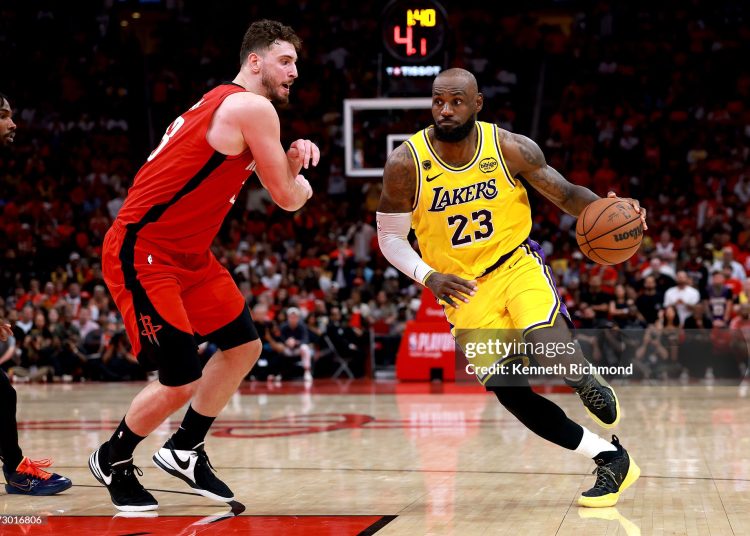 LeBron James #23 of the Los Angeles Lakers drives to the basket during overtime of the game against Alperen Sengun #28 of the Houston Rockets (Photo by Kenneth Richmond/Getty Images)