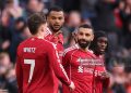 LIVERPOOL, ENGLAND - APRIL 11: Mohamed Salah of Liverpool celebrates scoring his team's second goal with teammates Cody Gakpo and Jeremie Frimpong during the Premier League match between Liverpool and Fulham at Anfield on April 11, 2026 in Liverpool, England. (Photo by Carl Recine/Getty Images)