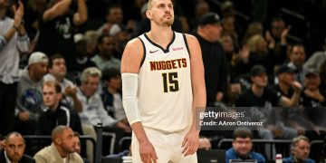 Nikola Jokic (15) of the Denver Nuggets stands on the court befuddled as the Minnesota Timberwolves do everything to take the advantage during the second quarter (Photo by AAron Ontiveroz/The Denver Post)