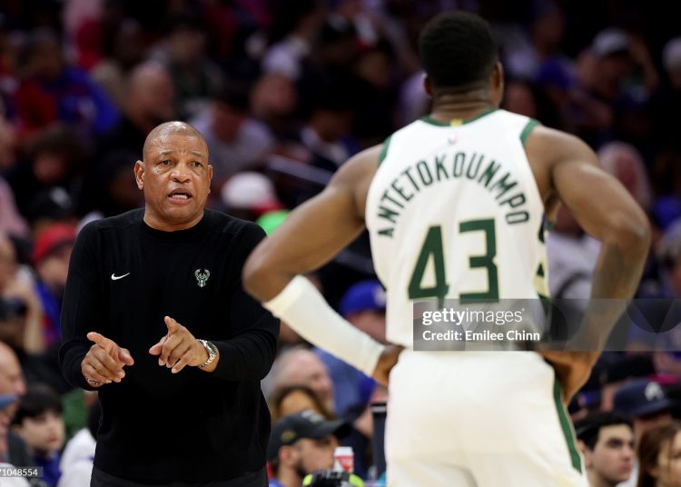 Doc Rivers talks to Thanasis Antetokounmpo #43 during the first half against the Philadelphia Sixers (Photo by Emilee Chinn/Getty Images)