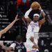 Shai Gilgeous-Alexander #2 of the Oklahoma City Thunder passes the ball over Kobe Sanders #4 and Derrick Jones Jr. #5 of the Los Angeles Clippers during the first half of an NBA game (Photo by Ryan Sirius Sun/Getty Images)